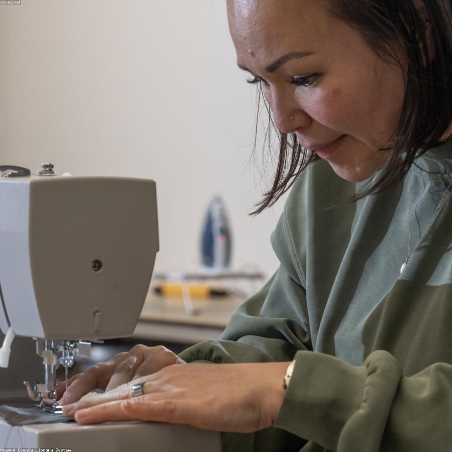 Embroidery machine stitching a custom design in the GMI Co. studio